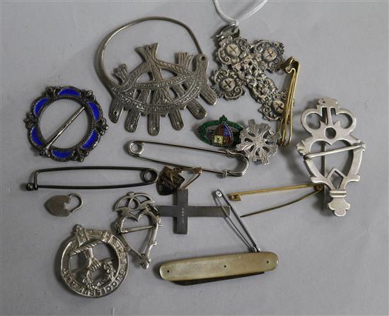 A mixed group of mainly silver items including South American? cross pendant, Scottish brooch and silver and enamel brooch.